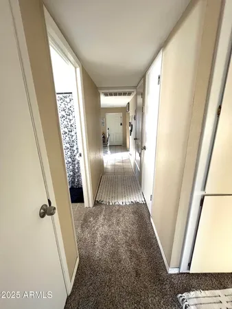 a view of a hallway view with staircase