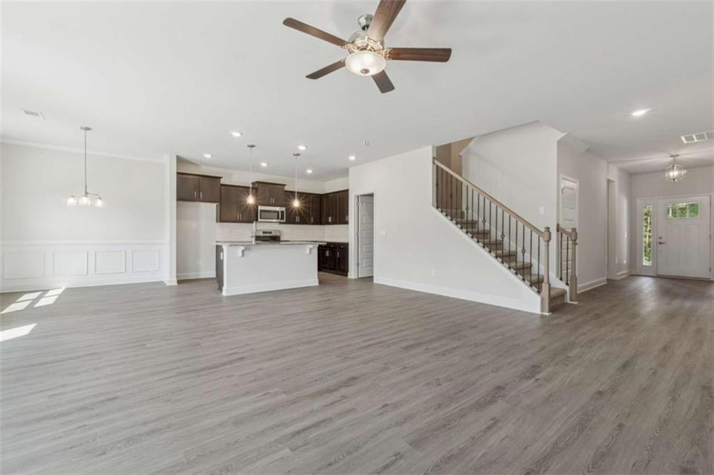 263 Eason Street Bowdon, GA 30108 - Photo 6 of 11 a view of a kitchen with a sink and a ceiling fan
