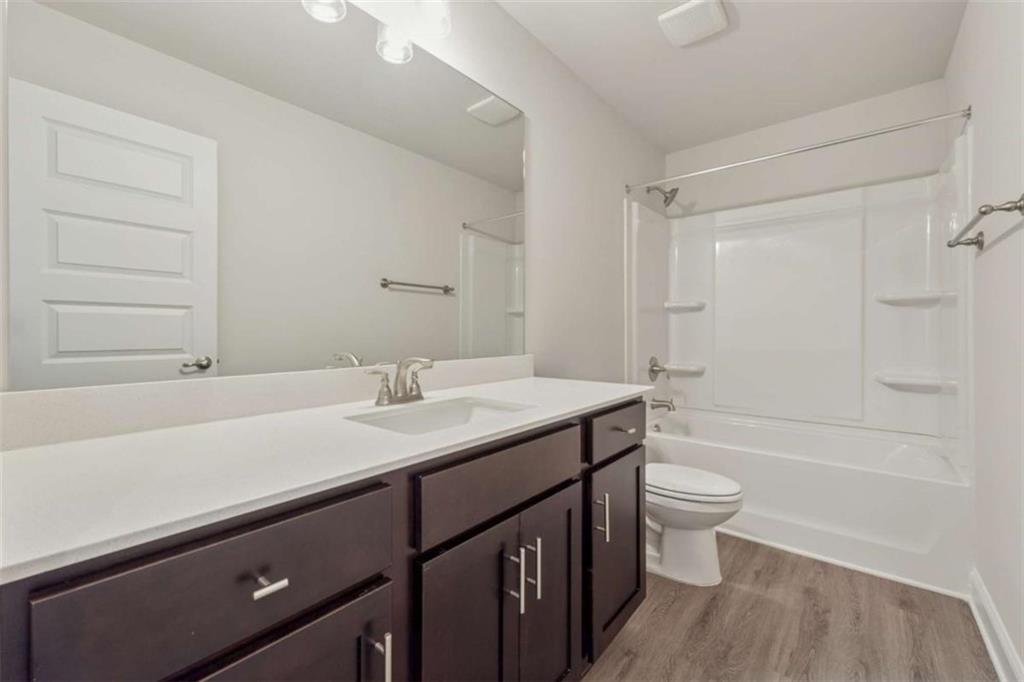 263 Eason Street Bowdon, GA 30108 - Photo 7 of 11 a bathroom with a sink a toilet and bathtub