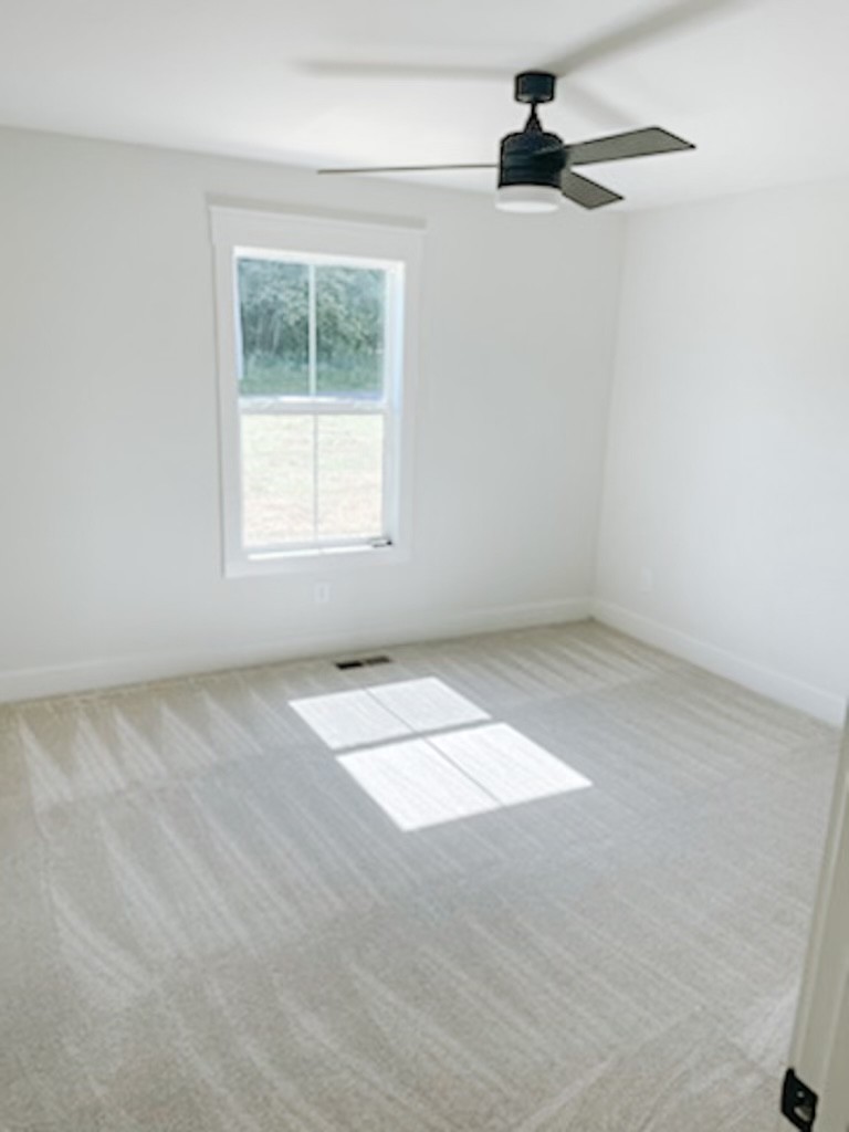 243 Tom Ferrell Road Portland, TN 37148 - Photo 15 of 17 an empty room with a window
