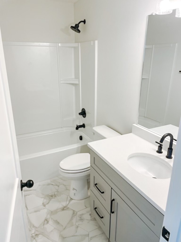 243 Tom Ferrell Road Portland, TN 37148 - Photo 16 of 17 a bathroom with a sink a toilet and shower