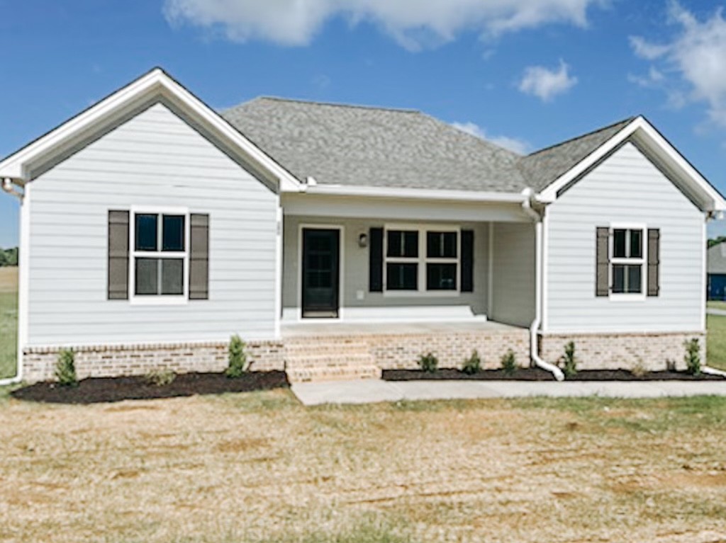 243 Tom Ferrell Road Portland, TN 37148 - Photo 2 of 17 a view of a white house with a yard