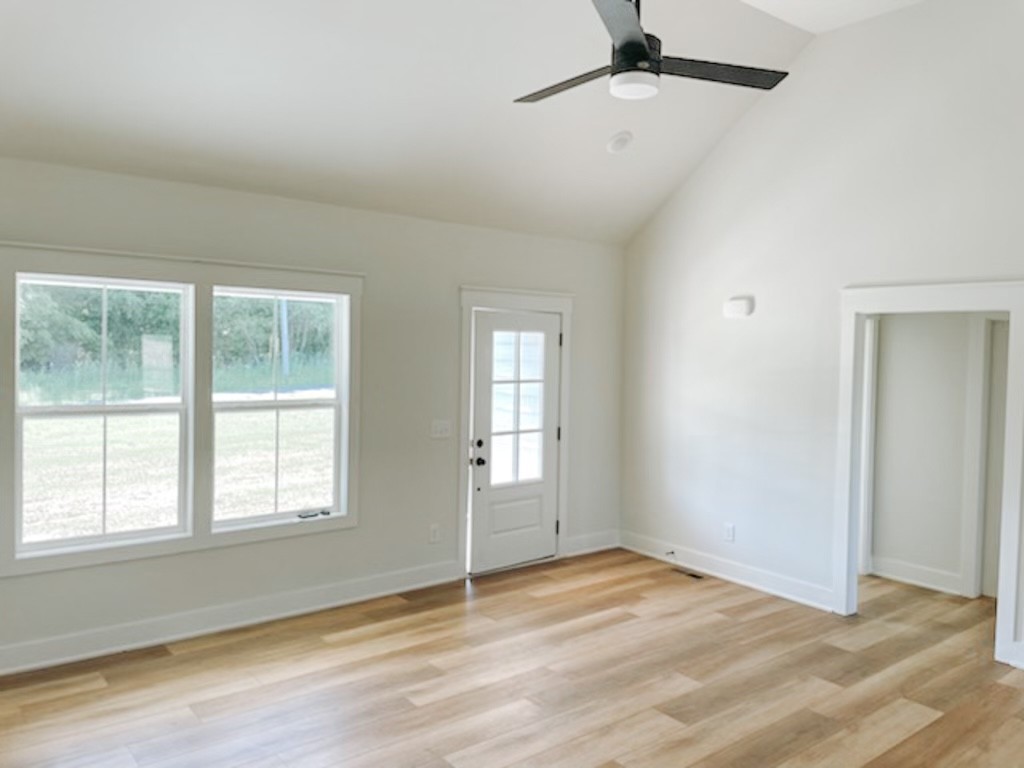 243 Tom Ferrell Road Portland, TN 37148 - Photo 8 of 17 a view of empty room with wooden floor and fan