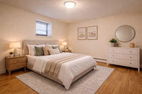 a bedroom with a bed and a dresser