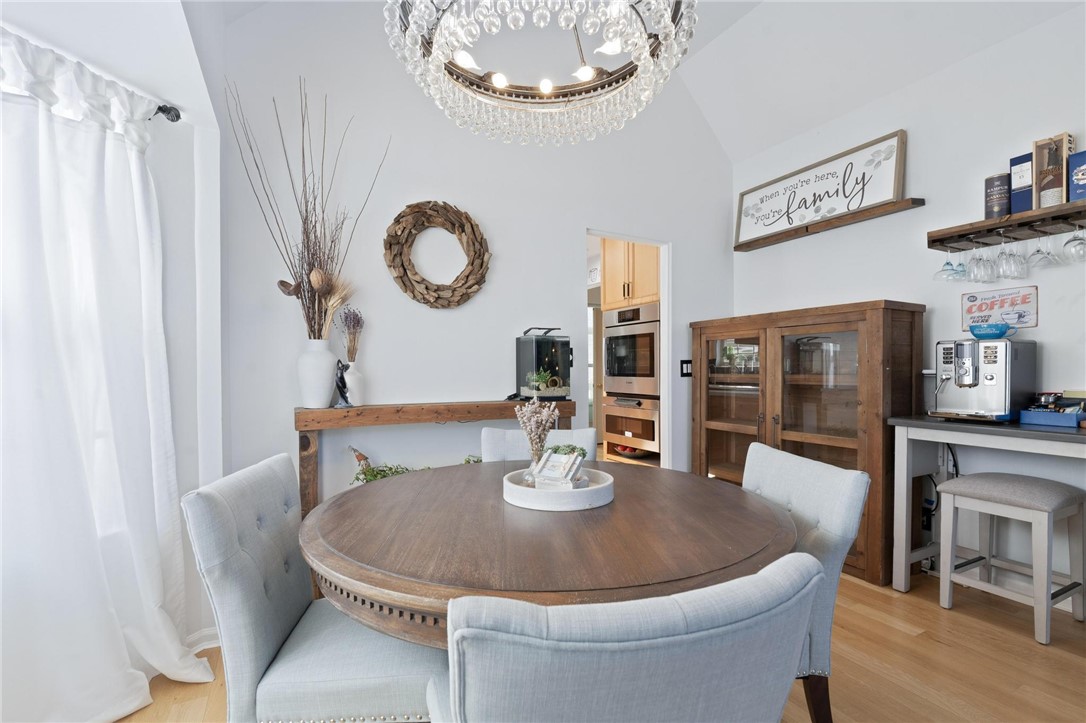 8781 Rupp Farm Drive West Chester, OH 45069 - Photo 21 of 48 This bright dining area features vaulted ceilings and light wood flooring, creating an inviting atmosphere.
