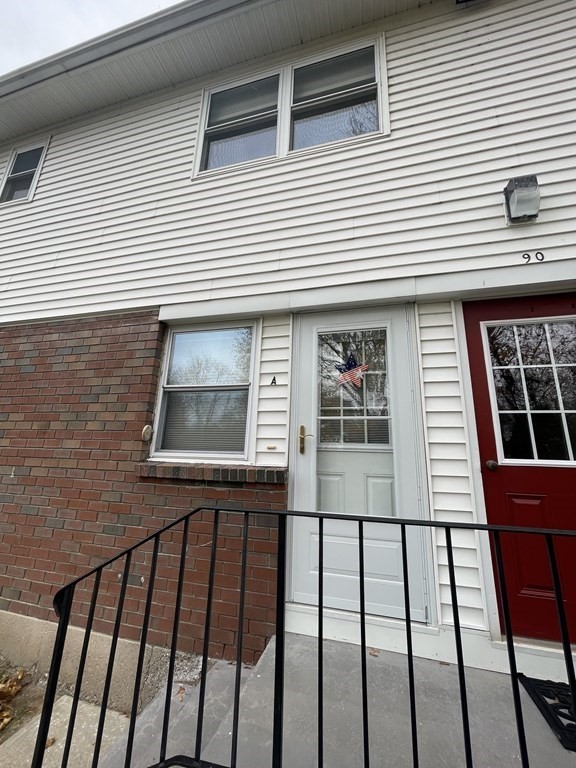 a view of a brick house with a large window
