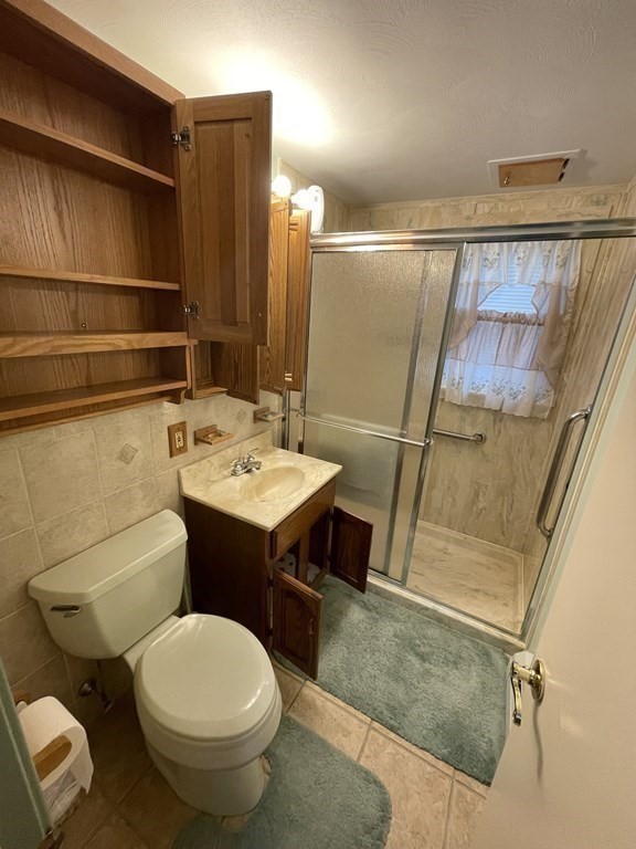 90 Colonial Circle, Unit A Chicopee, MA 01020 - Photo 11 of 17 a bathroom with a sink toilet and shower