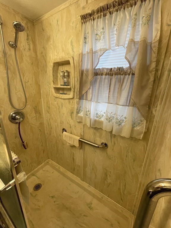 90 Colonial Circle, Unit A Chicopee, MA 01020 - Photo 12 of 17 a bathroom with a shower