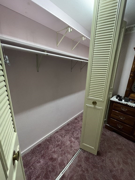 90 Colonial Circle, Unit A Chicopee, MA 01020 - Photo 14 of 17 a view of a room with furniture and staircase