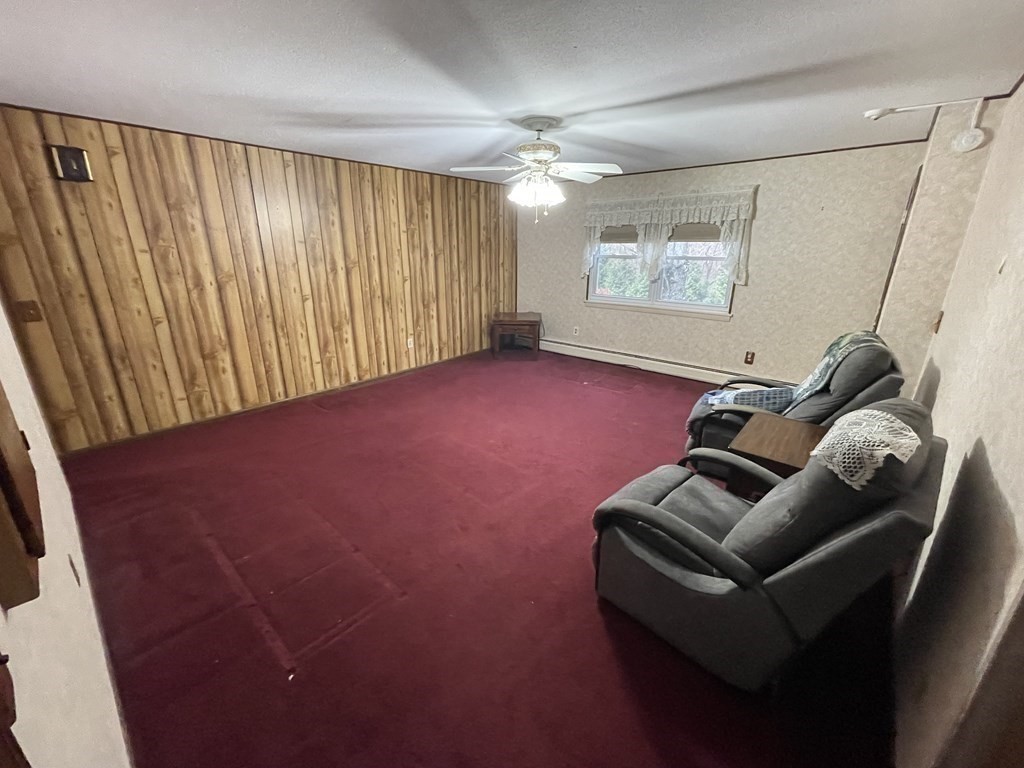90 Colonial Circle, Unit A Chicopee, MA 01020 - Photo 8 of 17 a living room with furniture and a flat screen tv