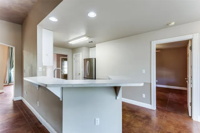 a view of a livingroom with a ceiling fan and window