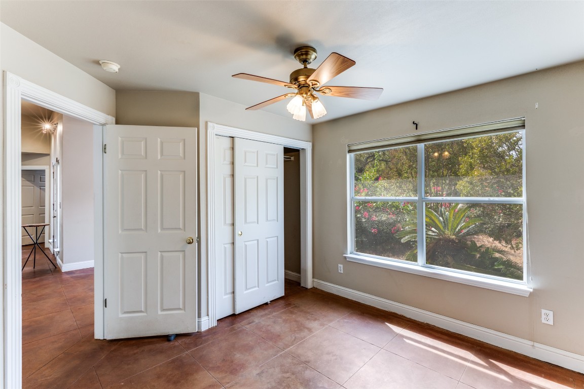 5718 McCarty Lane, Unit B Austin, TX 78749 - Photo 14 of 25 wooden floor in an empty room with a window