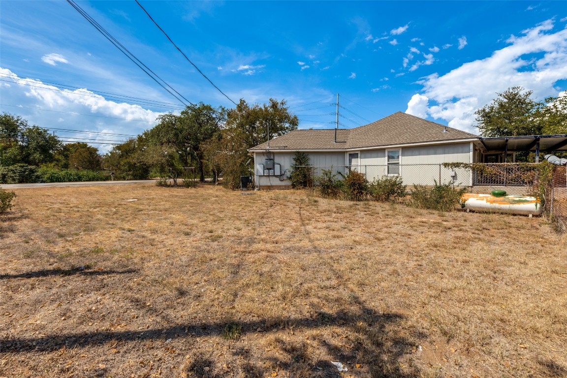 5718 McCarty Lane, Unit B Austin, TX 78749 - Photo 25 of 25 a front view of a house with a garden