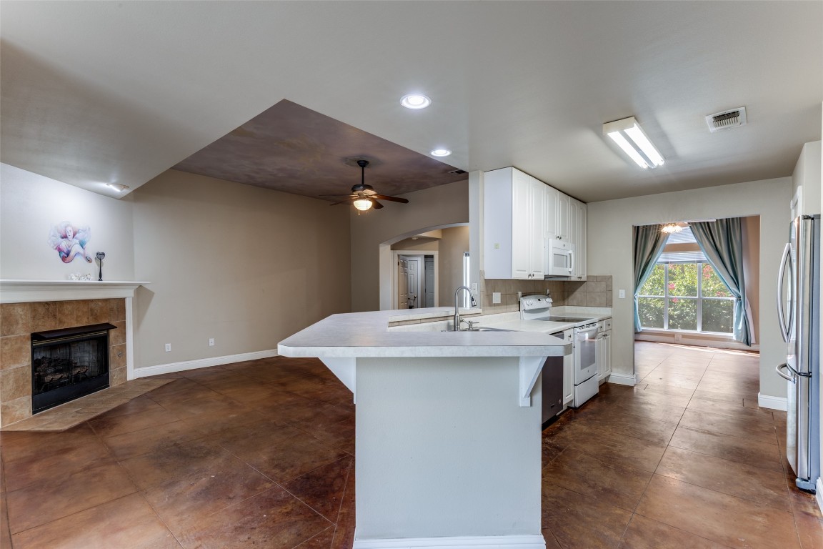 5718 McCarty Lane, Unit B Austin, TX 78749 - Photo 6 of 25 a kitchen with a sink cabinets and wooden floor