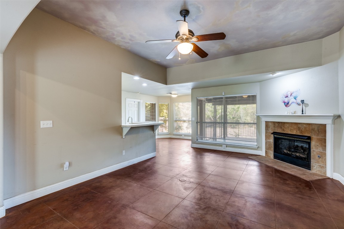 5718 McCarty Lane, Unit B Austin, TX 78749 - Photo 9 of 25 a view of an empty room with a fireplace and a window