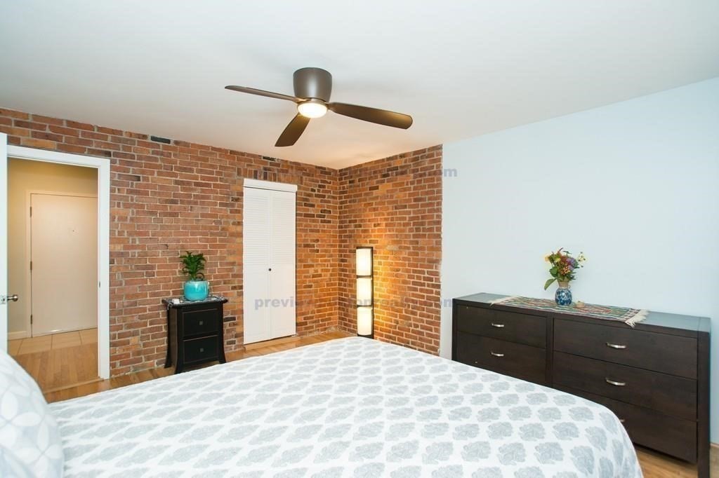 29 Brainerd Road, Unit 304 Boston, MA 02134 - Photo 13 of 22 a bedroom with a bed and a dresser