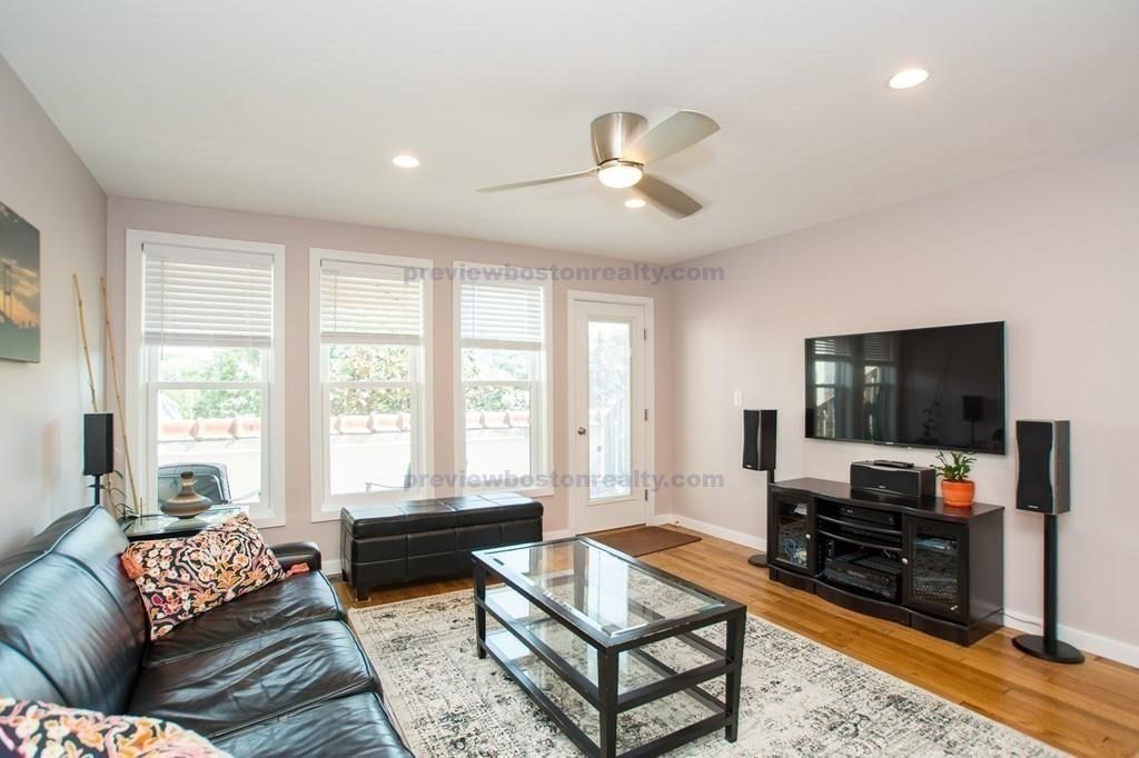 29 Brainerd Road, Unit 304 Boston, MA 02134 - Photo 14 of 22 a living room with furniture and a flat screen tv