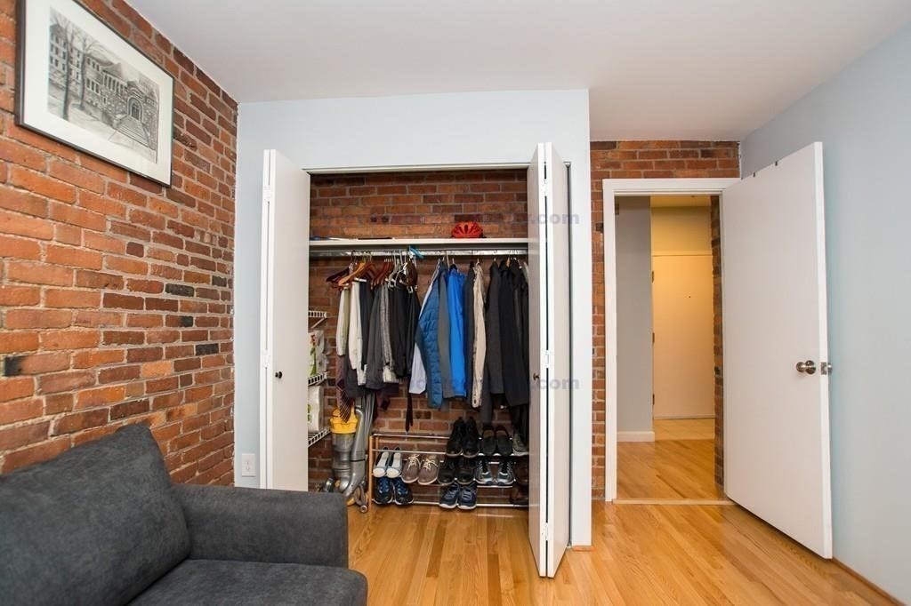 29 Brainerd Road, Unit 304 Boston, MA 02134 - Photo 7 of 22 a living room with furniture and a walk in closet