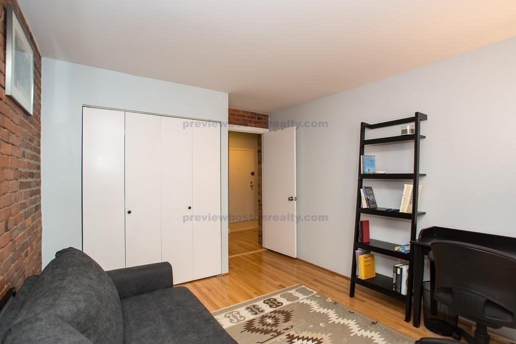29 Brainerd Road, Unit 304 Boston, MA 02134 - Photo 9 of 22 a view of a livingroom with furniture and cabinet