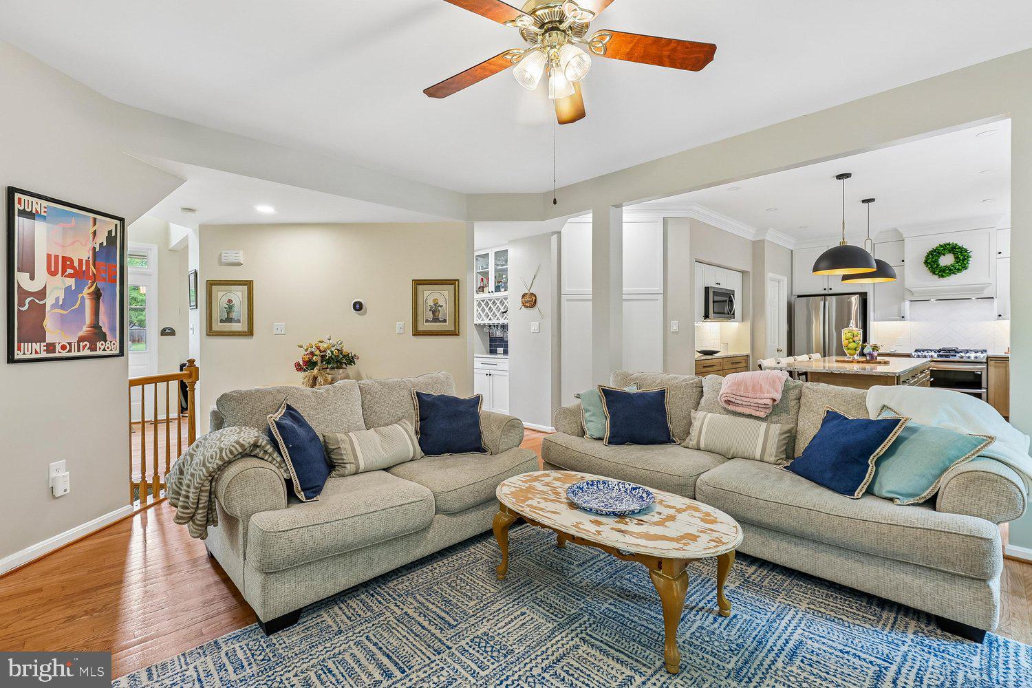 3707 Turn Back Trail Triangle, VA 22172 - Photo 12 of 55 a living room with furniture a table and a chandelier