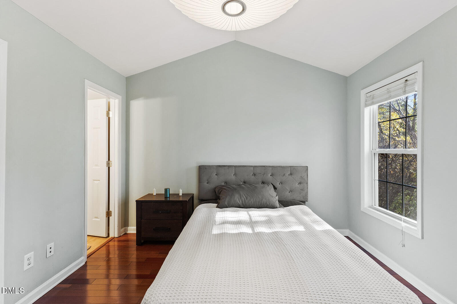 12 Byerly Court Durham, NC 27713 - Photo 13 of 28 a bedroom with a bed and wooden floor