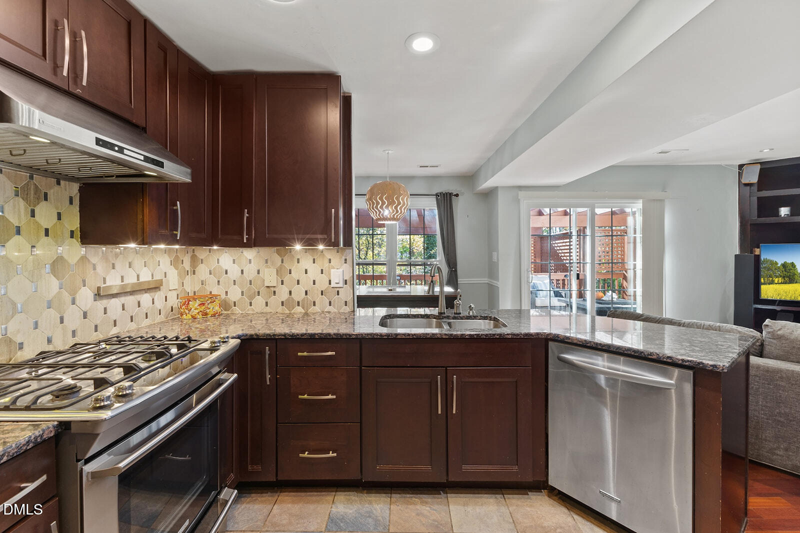 12 Byerly Court Durham, NC 27713 - Photo 8 of 28 a kitchen with granite countertop stainless steel appliances a sink stove and cabinets