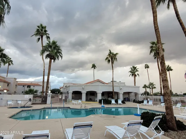 a front view of multiple houses with yard