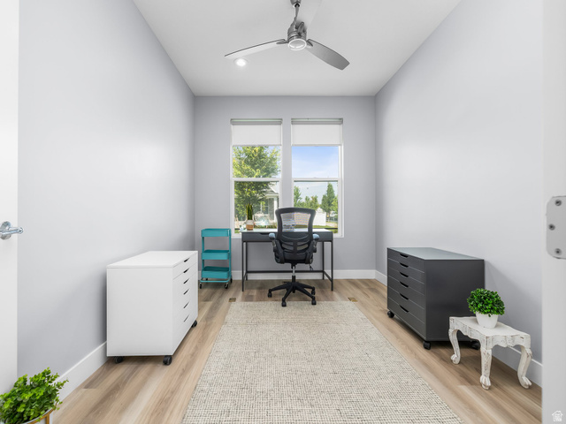 877 South Yarrow Drive Mapleton, UT 84664 - Photo 24 of 46 Bright room with light wood-finish flooring, two large windows, a ceiling fan with integrated lighting, and white baseboards