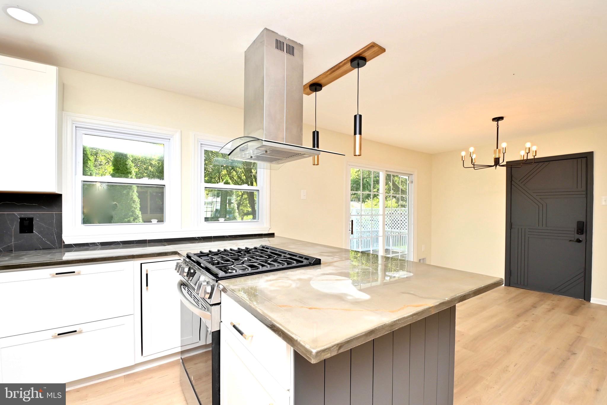 7215 Willow Oak Place Springfield, VA 22153 - Photo 13 of 39 a kitchen with a sink a stove and a refrigerator