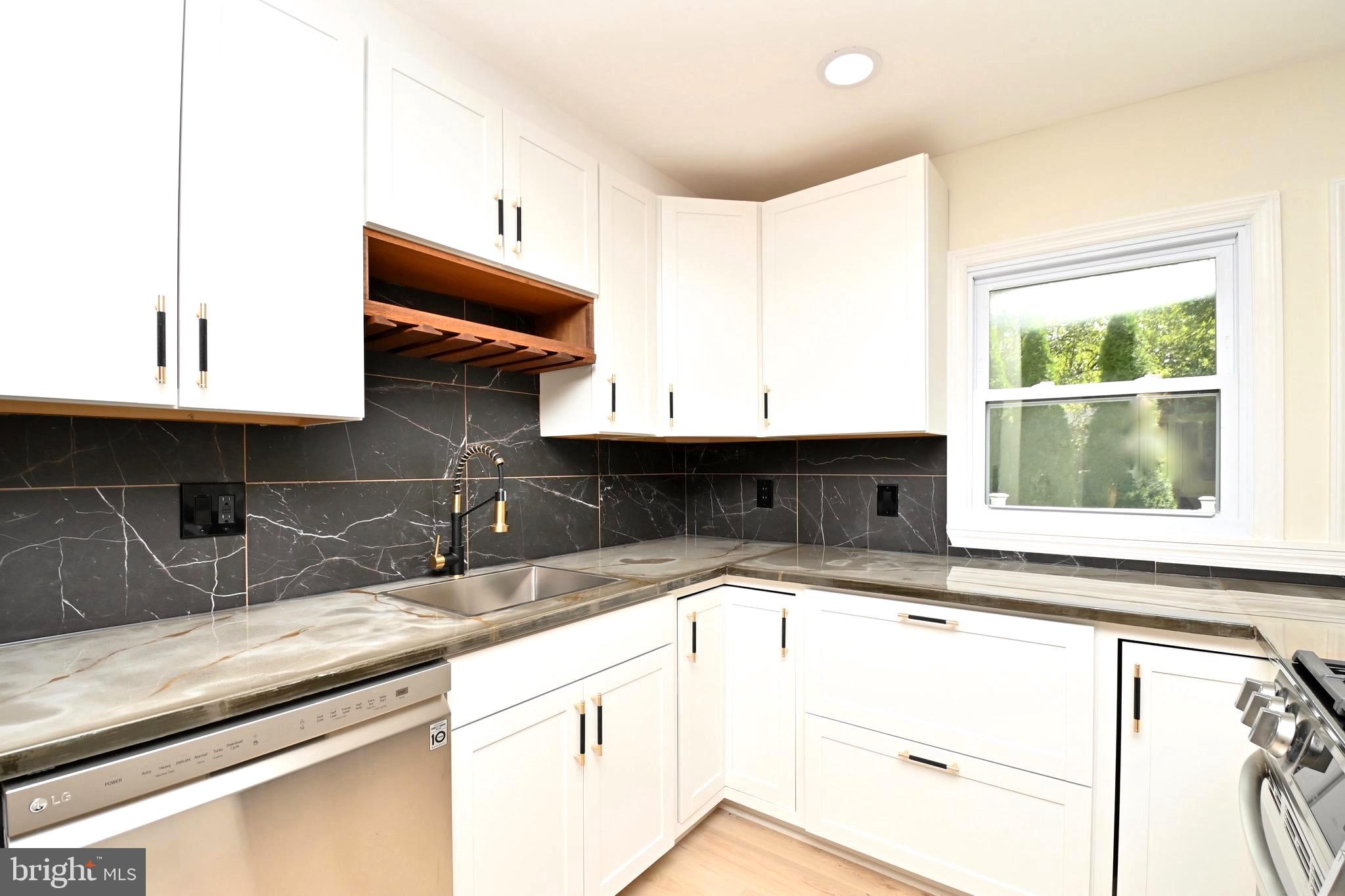 7215 Willow Oak Place Springfield, VA 22153 - Photo 14 of 39 a kitchen with a sink and a window