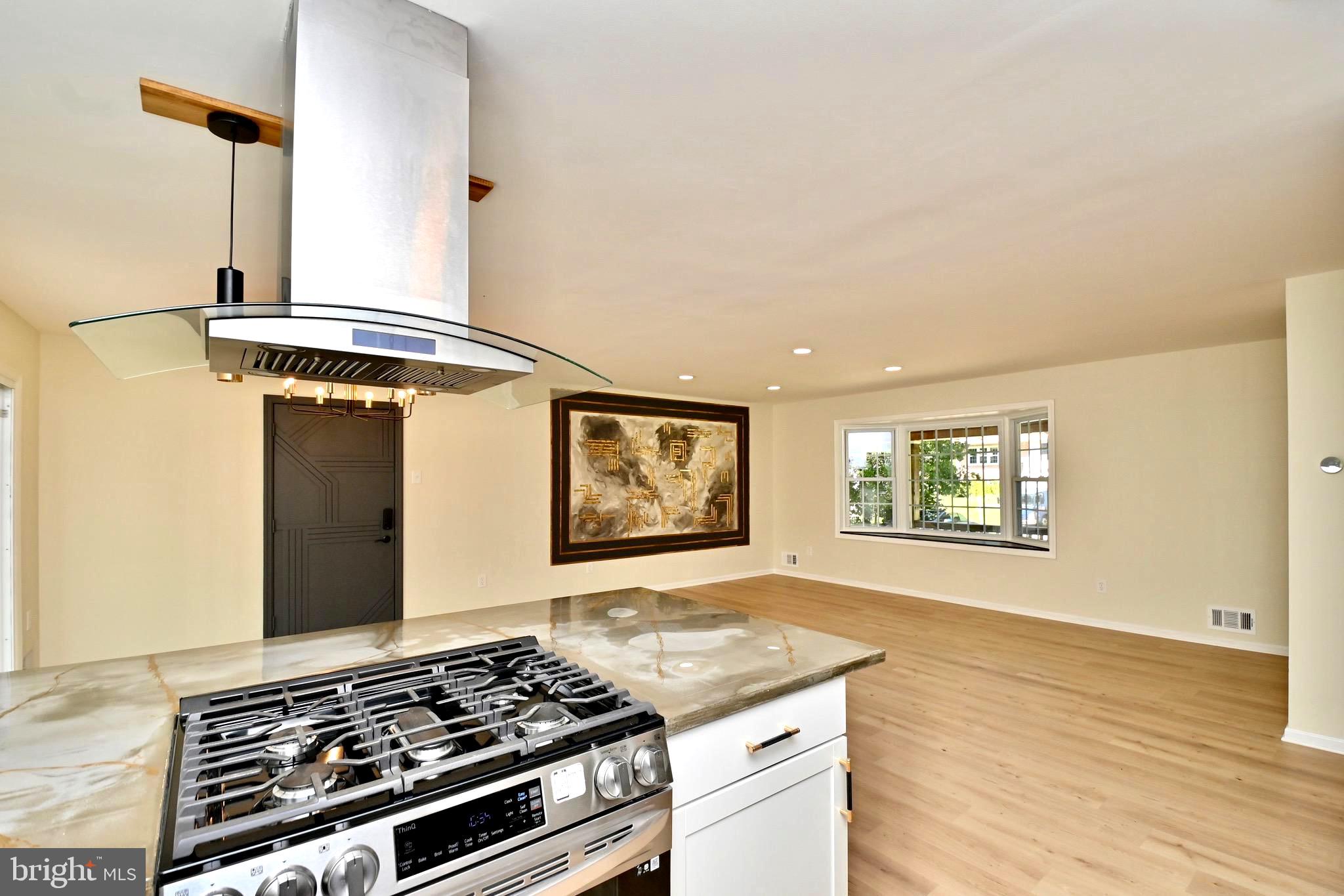 7215 Willow Oak Place Springfield, VA 22153 - Photo 15 of 39 a kitchen with stainless steel appliances granite countertop a stove and a window