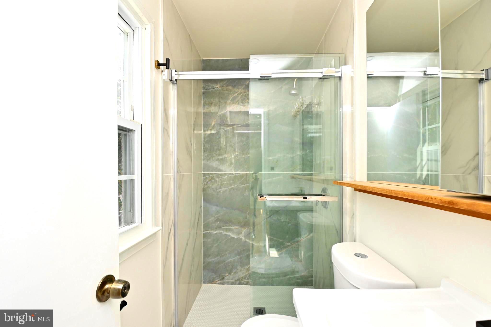 7215 Willow Oak Place Springfield, VA 22153 - Photo 25 of 39 a bathroom with a shower