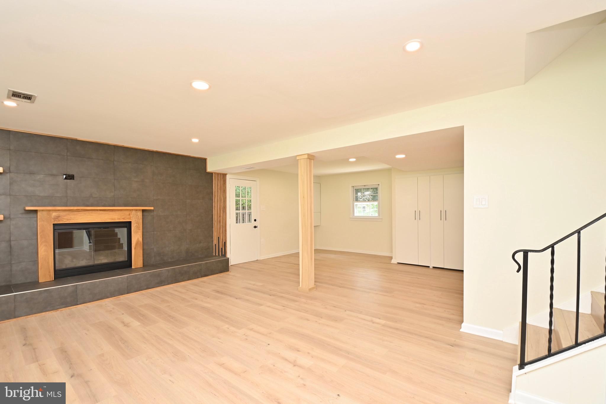 7215 Willow Oak Place Springfield, VA 22153 - Photo 28 of 39 a view of an empty room with window and wooden floor