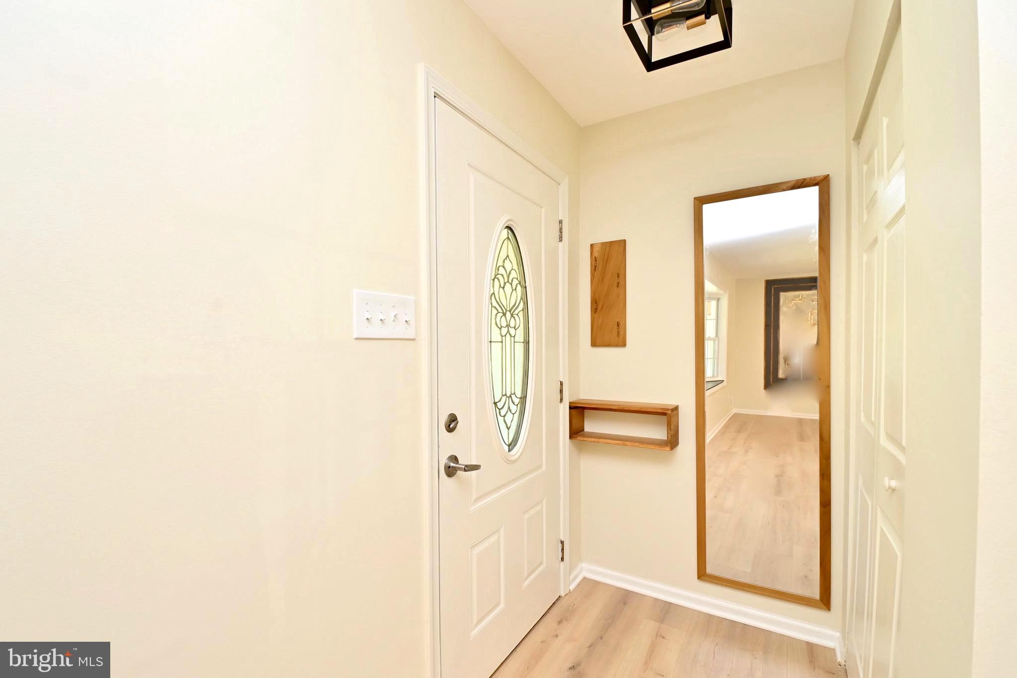 7215 Willow Oak Place Springfield, VA 22153 - Photo 3 of 39 a view of walk in closet with chandelier