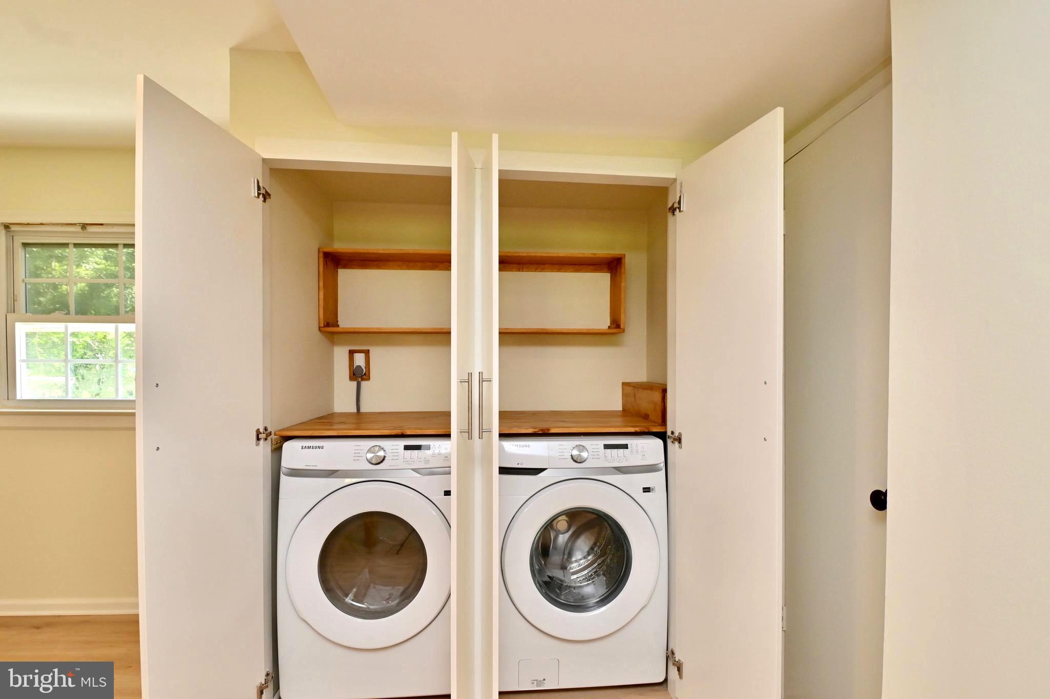 7215 Willow Oak Place Springfield, VA 22153 - Photo 32 of 39 a view of a bedroom with washer and dryer