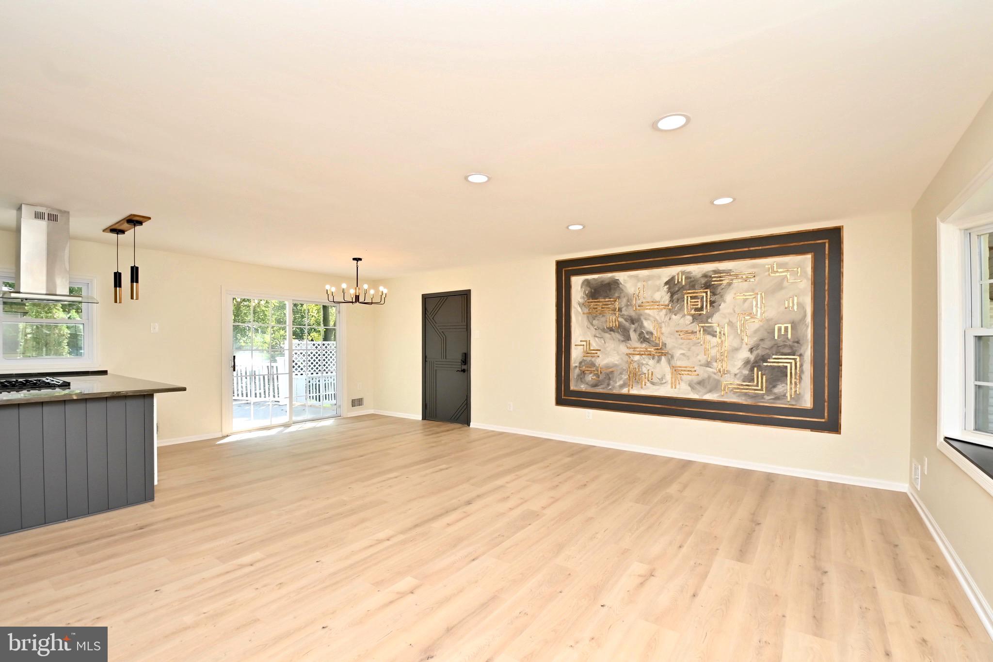 7215 Willow Oak Place Springfield, VA 22153 - Photo 4 of 39 a big room with wooden floor and windows