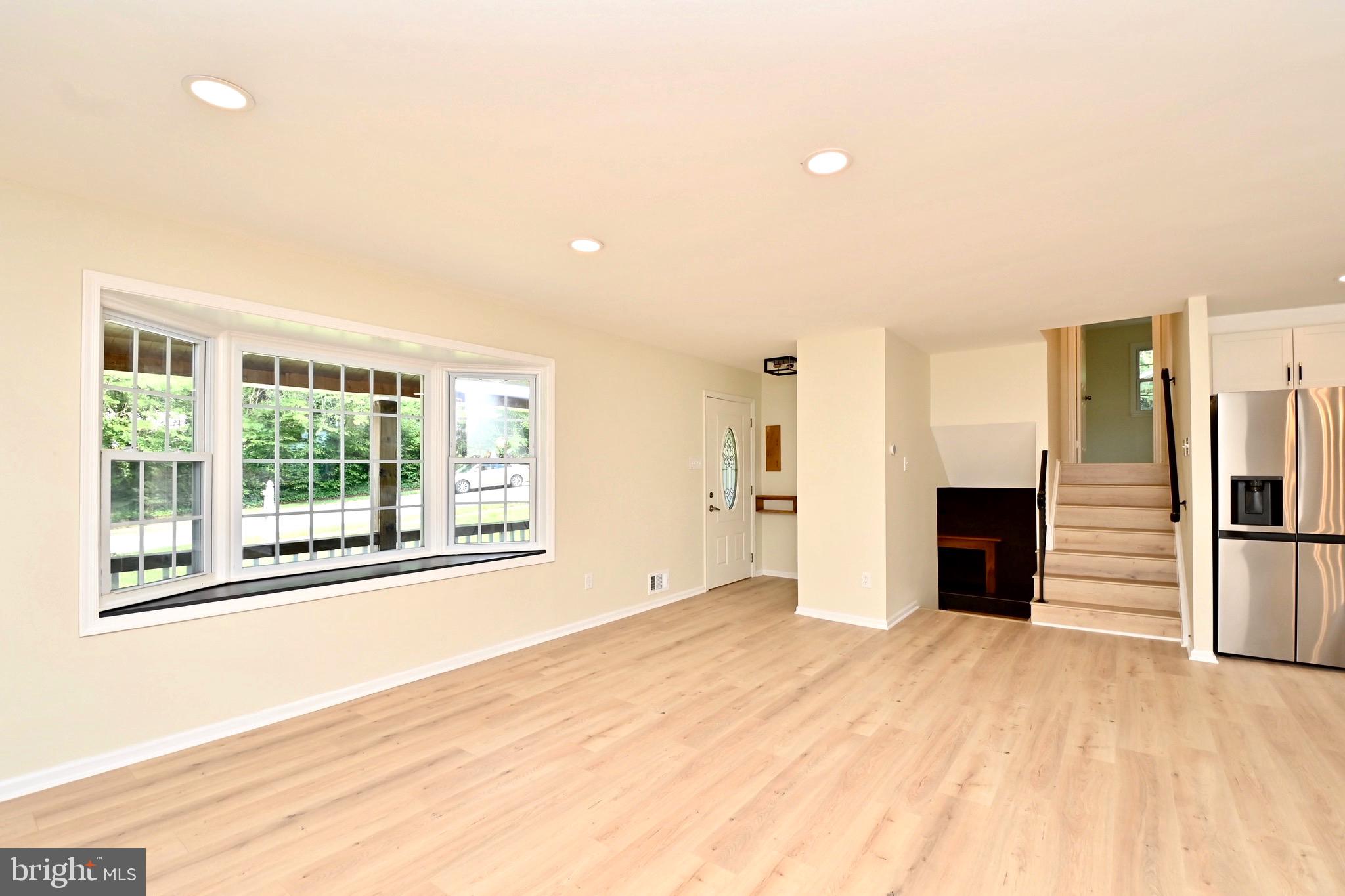 7215 Willow Oak Place Springfield, VA 22153 - Photo 7 of 39 a view of an empty room with a window and fire place
