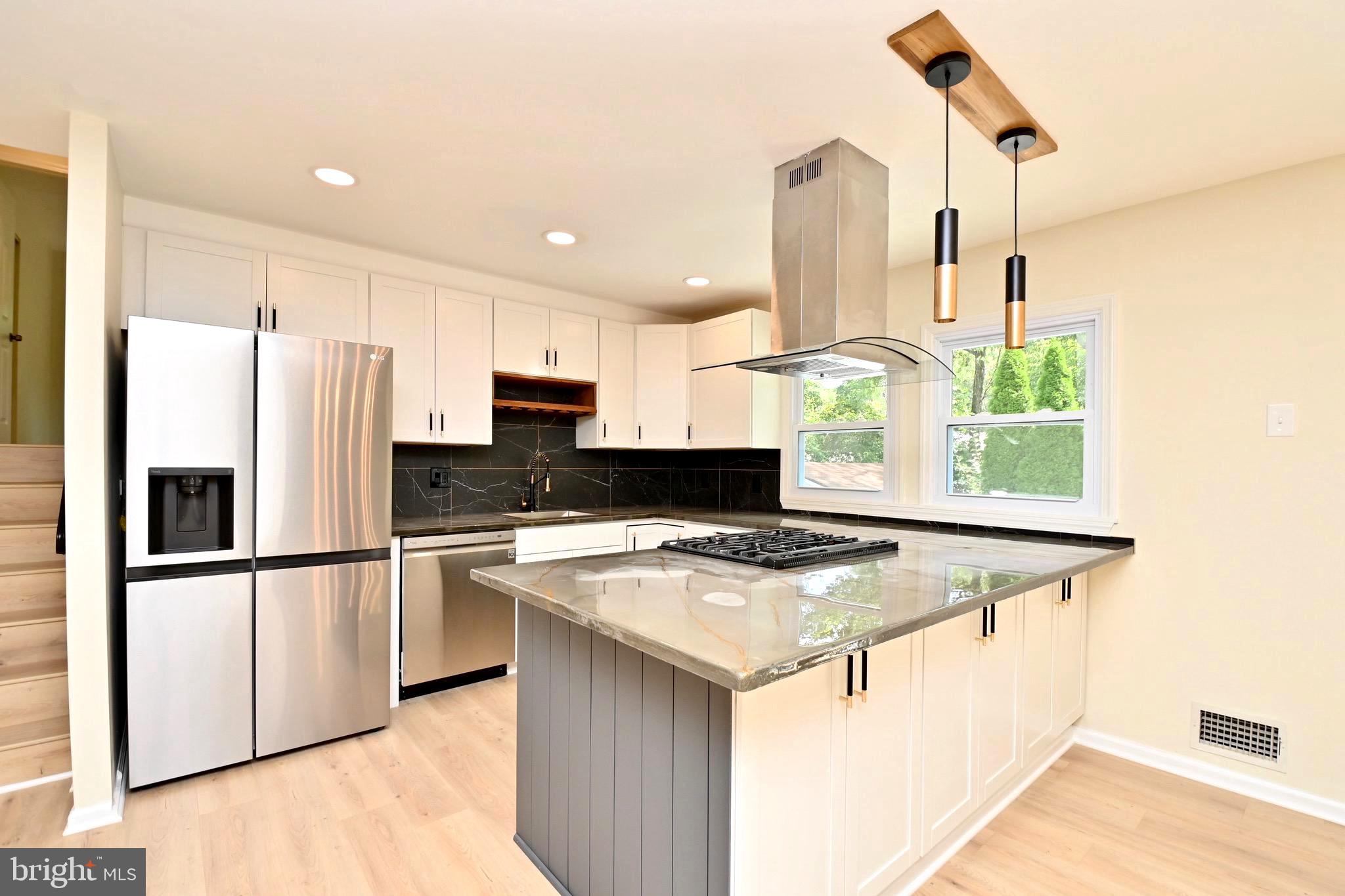 7215 Willow Oak Place Springfield, VA 22153 - Photo 10 of 39 a kitchen with stainless steel appliances granite countertop a refrigerator a stove and a sink