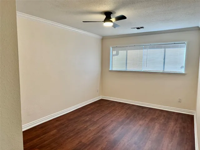 a bathroom with a double vanity sink and mirror with bathtub