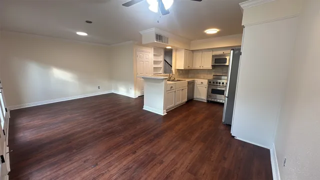 a kitchen with a sink cabinets and window
