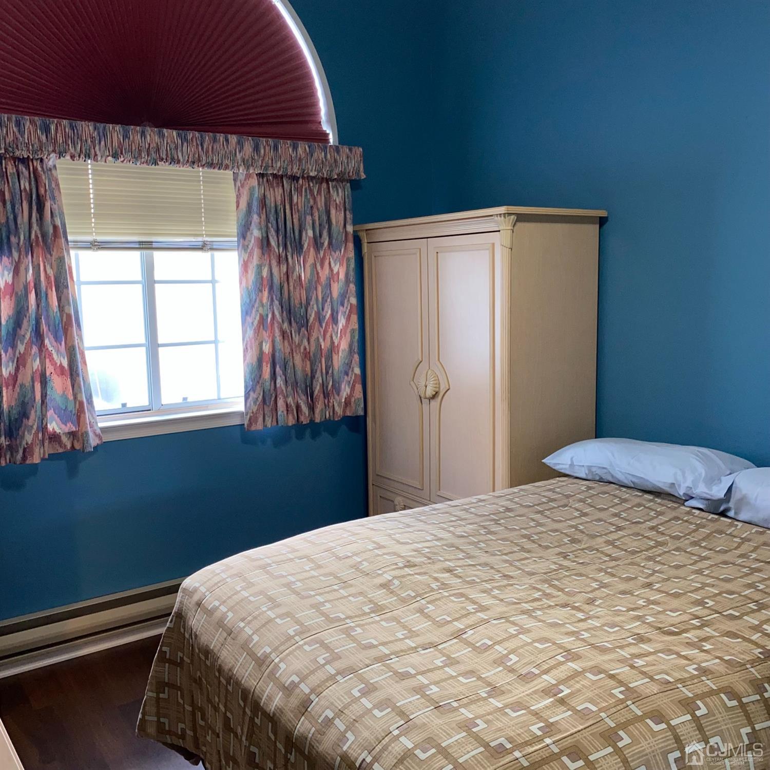 838 Vail Road, Unit A Monroe Township, NJ 08831 - Photo 11 of 16 a bedroom with a bed and a window