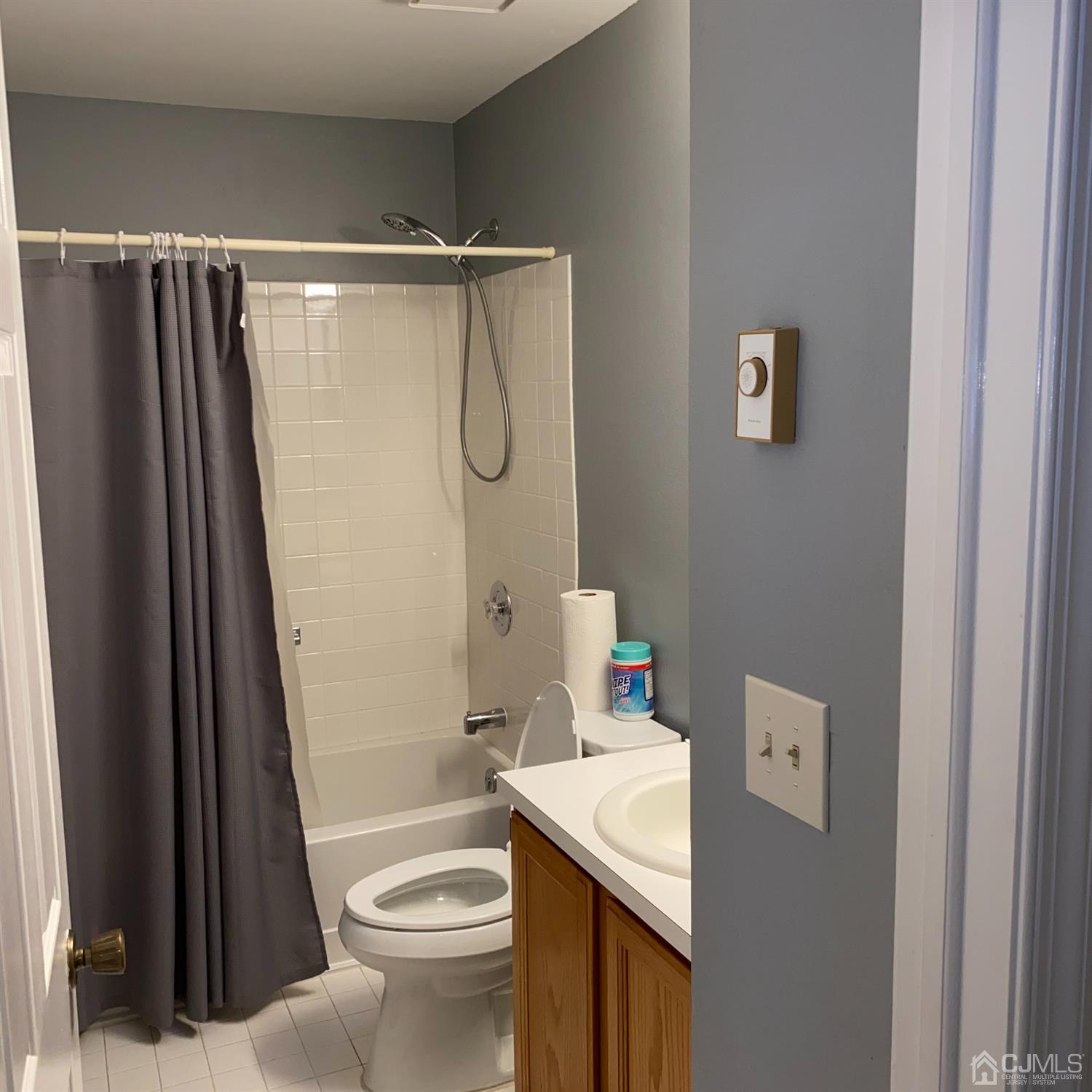 838 Vail Road, Unit A Monroe Township, NJ 08831 - Photo 13 of 16 a bathroom with a sink a toilet and shower