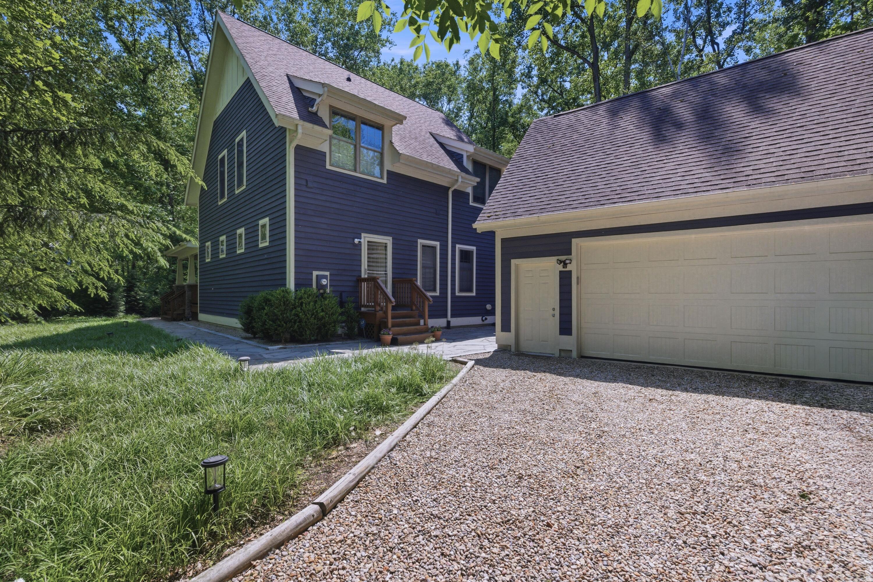 71 Timber Trail Michigan City, IN 46360 - Photo 26 of 27 a front view of a house with garden