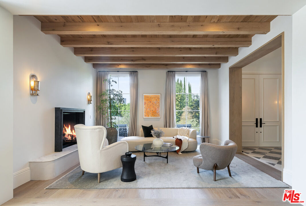 15620 Woodvale Road Encino, CA 91436 - Photo 11 of 37 a living room with furniture and a large window