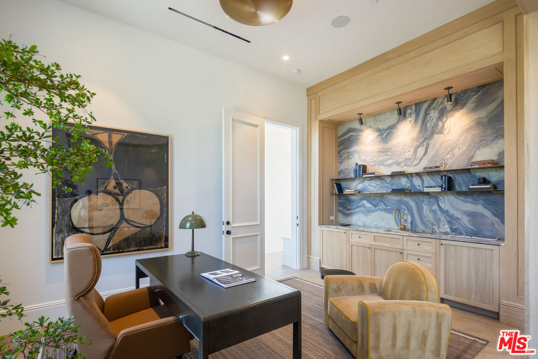 15620 Woodvale Road Encino, CA 91436 - Photo 18 of 37 a living room with furniture and a window