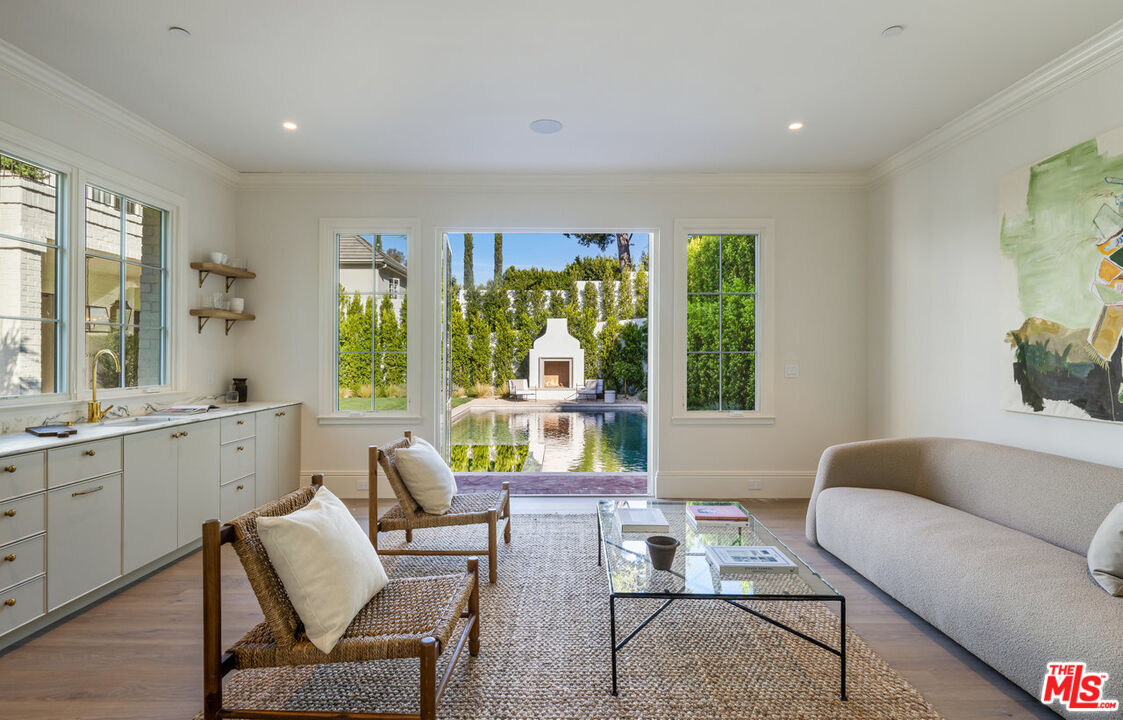 15620 Woodvale Road Encino, CA 91436 - Photo 37 of 37 a living room with furniture and a large window