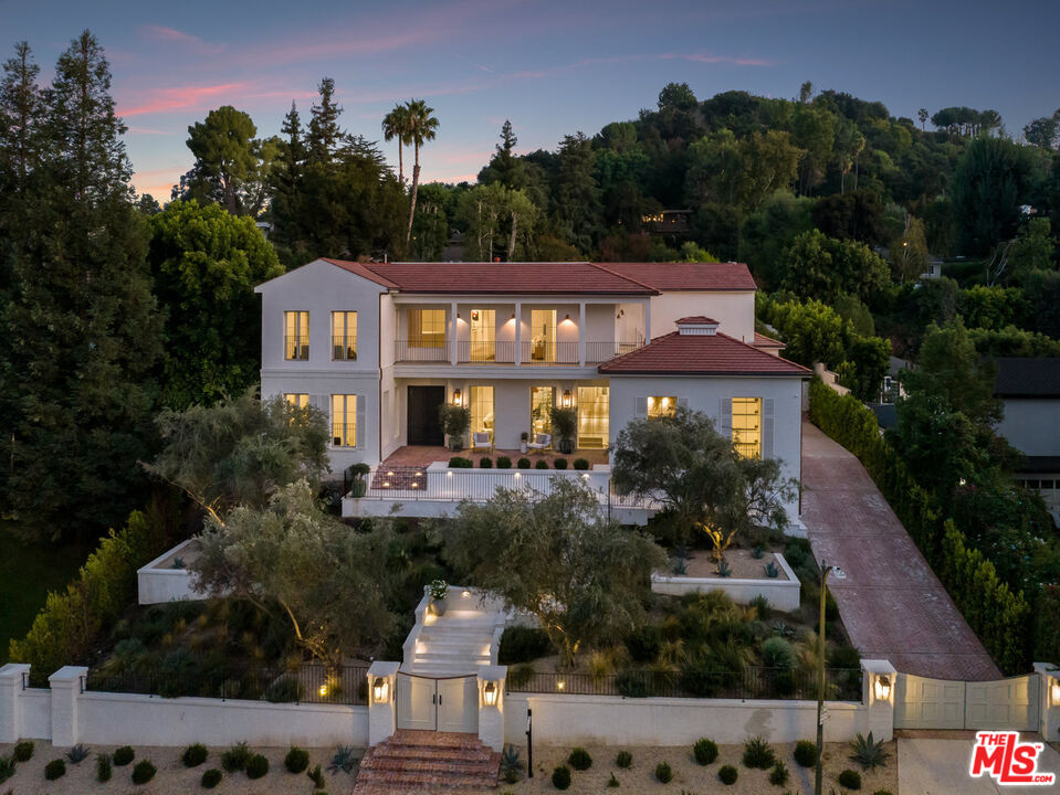 15620 Woodvale Road Encino, CA 91436 - Photo 6 of 37 a front view of house with yard and green space