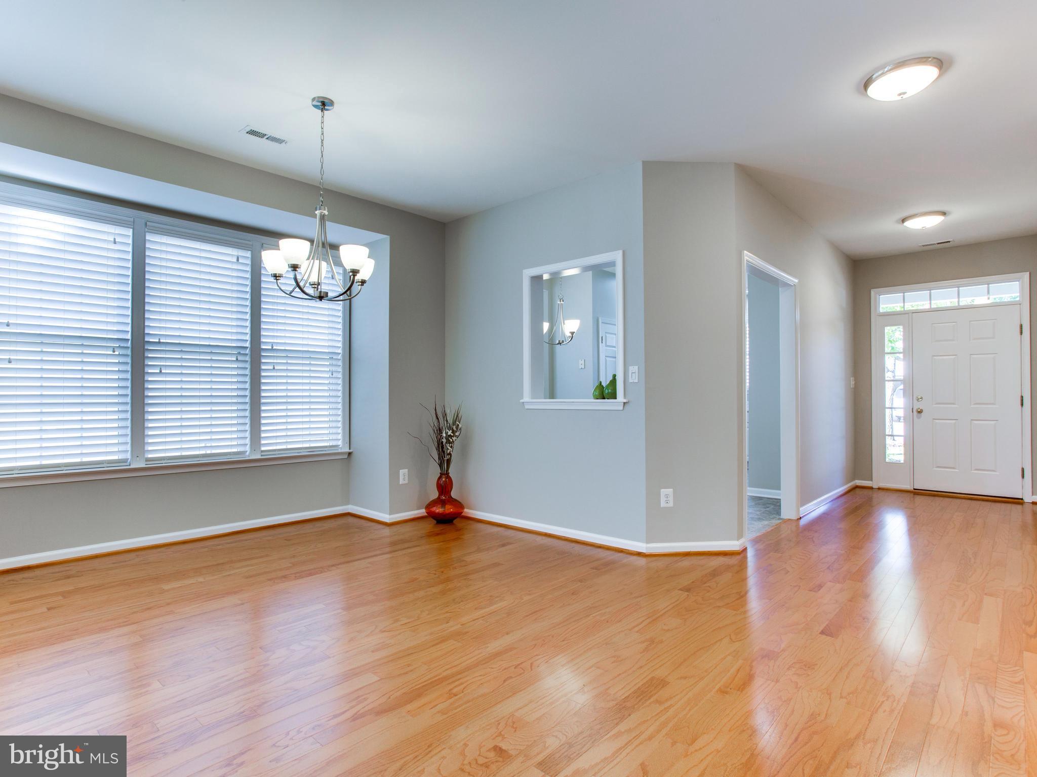 13583 Ryton Ridge Lane Gainesville, VA 20155 - Photo 11 of 28 Dining Room - NEW hardwoods & chandelier