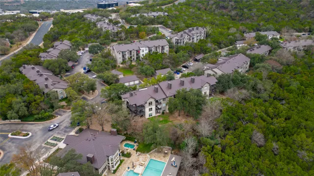 an aerial view of a houses with outdoor space and street view