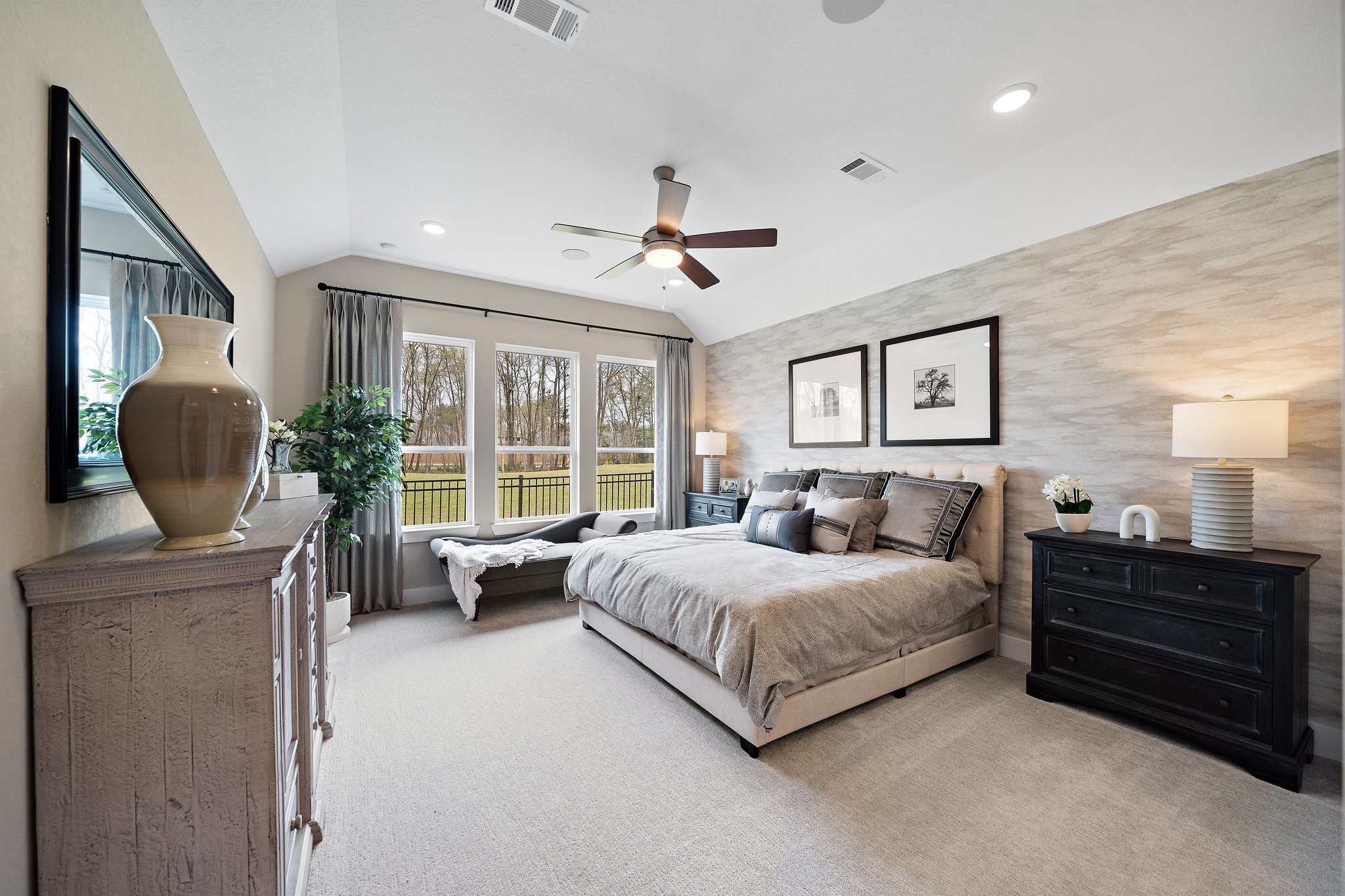 21702 Leaton Circle Porter, TX 77365 - Photo 14 of 36 Spacious primary suite with elegant furnishings (included), abundant natural light, and peaceful backyard golf course views.